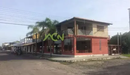 Prédio residencial e comercial em terreno de esquina, na Av Mariluz, em Imbé