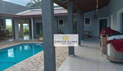 Casa térrea com 4 dormitórios, 4 suítes à venda, 338 m² - Condomínio Lago Dourado