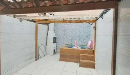 Sobrado com 3 dormitórios à venda, 97 m² por R$ 650.000,00 - Tombo - Guarujá/SP
