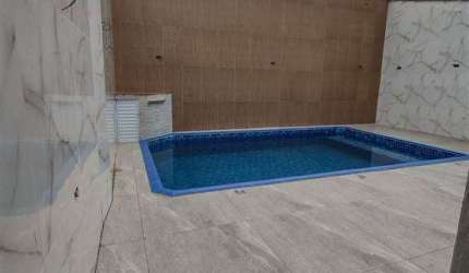Casa na Praia Grande,com piscina 2 quartos sendo 1 suite 3 garagem