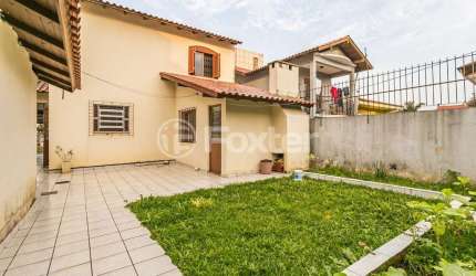 Casa com 3 quartos à venda na Avenida Doutor Saulo Coelho, 120, Parque Santa Fé, Porto Alegre, 120 m2 por R$ 585.000
