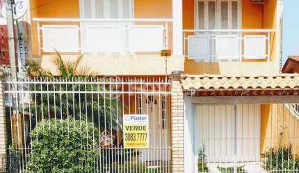 Casa com 3 quartos à venda na Rua Tesourinha, 174, Jardim Algarve, Alvorada, 220 m2 por R$ 371.000