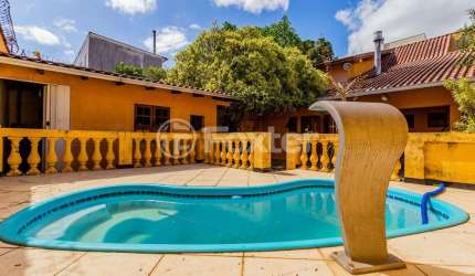 Casa com 2 quartos à venda na Rua Afonso Rodrigues, 263, Jardim Botânico, Porto Alegre, 194 m2 por R$ 1.150.000