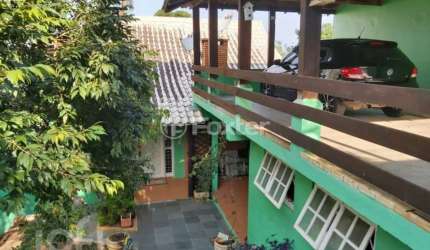 Casa com 3 quartos à venda na Avenida Doutor Rubem Knijnik, 345, Costa e Silva, Porto Alegre, 265 m2 por R$ 695.000