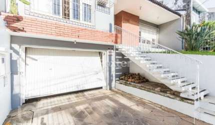 Casa com 3 quartos à venda na Rua Coronel Tisiano F. de Leoni, 290, Coronel Aparício Borges, Porto Alegre, 183 m2 por R$ 680.000