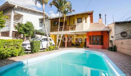 Casa com 4 quartos à venda na Rua Cacilda Yaconis Becker, 223, Rubem Berta, Porto Alegre, 300 m2 por R$ 693.500