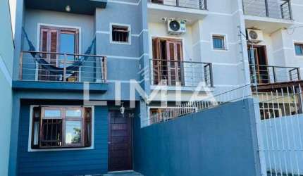 Casa com 3 quartos à venda na Rua Hugo Nelson Magalhães, 141, Parque Santa Fé, Porto Alegre, 170 m2 por R$ 425.000