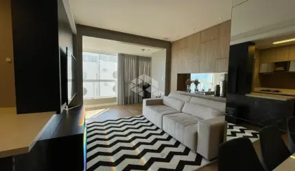 Apartamento com uma linda vista para o mar de  2 dormitórios, sendo 1 suíte, 2 vagas de garagem no bairro Coqueiros em Florianópolis/SC.