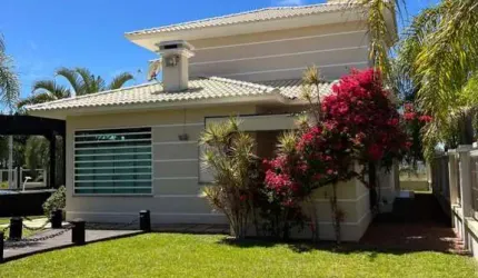 Casa 04 Dorm à venda no Bairro CAPÃO NOVO com 320 m² de área privativa - 2 vagas de garagem