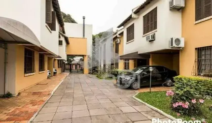 Casa em condomínio fechado com 3 quartos à venda na Rua Dona Zulmira, 376, Cavalhada, Porto Alegre por R$ 410.000