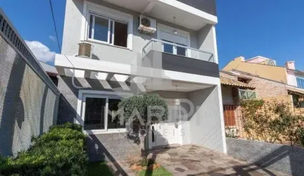 Casa em condomínio fechado com 3 quartos à venda na Rua Felipe Arísio, 121, Hípica, Porto Alegre por R$ 790.000
