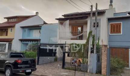 Casa com 3 quartos à venda na Rua Attilio Bettio, 92, Aberta dos Morros, Porto Alegre por R$ 580.000