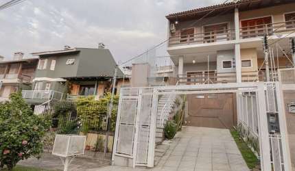 Casa com 3 quartos à venda na Avenida Doutor Francisco Roberto Dall Igna, 308, Espírito Santo, Porto Alegre por R$ 619.000