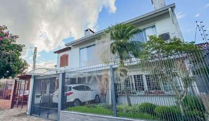 Casa com 4 quartos à venda na Rua Pedro Waine, 194, Santa Maria Goretti, Porto Alegre por R$ 835.000