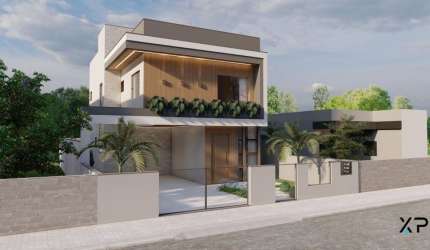Casa a venda com 3 quartos sendo 3 suítes, 3 banheiros e 2 vagas de garagem.