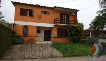 Casa com 3 quartos à venda na Rua Jacundá, 670, Guarujá, Porto Alegre por R$ 570.000