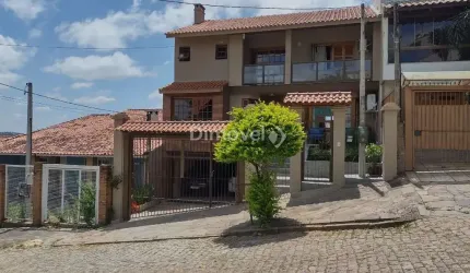 Casa com 3 quartos à venda na Rua Inês Vinhas, 45, Espírito Santo, Porto Alegre por R$ 1.090.000