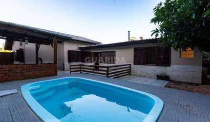 Casa com piscina e 4 dormitórios sendo 2 suítes para alugar no bairro Ipanema.