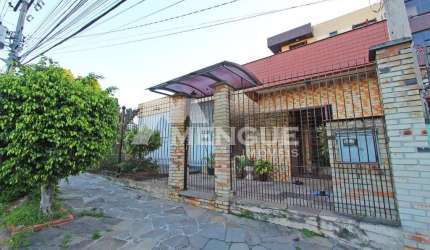 Casa com 5 quartos à venda na Rua Umbú, 566, Passo da Areia, Porto Alegre por R$ 1.500.000