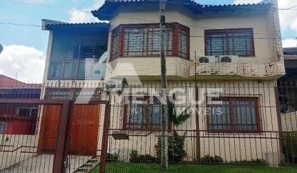 Casa com 3 quartos à venda na Rua General Telino Chagastelles, 245, Parque Santa Fé, Porto Alegre por R$ 1.200.000
