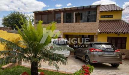 Casa com 3 quartos à venda na Rua Coronel José Rodrigues Sobral, 584, Partenon, Porto Alegre por R$ 2.100.000