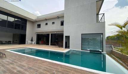 Casa nova em condomínio alto padrão com 5 suítes à venda, 695 m² por R$ 4.300.000