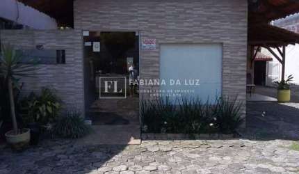 Terreno com 2 casas á venda