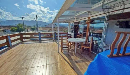 Sobrado com 3 dormitórios à venda, 142 m² por R$ 690.000,00 - Maracanã - Praia Grande/SP