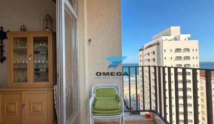 Apartamento com vista mar à venda na praia das Pitangueiras no Guarujá I Omega Imoveis