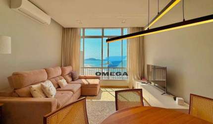 Apartamento frente mar à venda na praia das Pitangueiras no Guarujá I Omega Imoveis