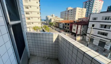 Amplo apartamento de 1 dormitório com vista lateral para o mar em Praia Grande SP