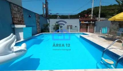 Sobrado à venda no bairro Martim de Sá em Caraguatatuba, 3 dormitórios, 3 banheiros, piscina, área