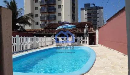 Casa à venda no bairro Martim de Sá - 3 dormitórios com ar condicionado, 3 banheiros, cozinha, área