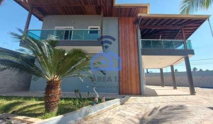Lindíssimo sobrado com piscina e vista para o mar à venda no bairro Praia das Palmeiras em Caraguat