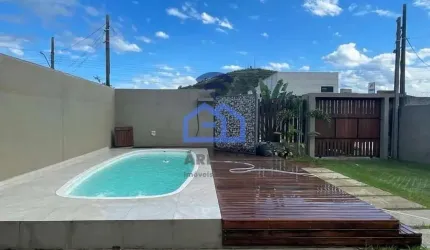 Casa com piscina à venda no bairro Cidade Jardim em Caraguatatuba, SP - Viva com conforto e comodid