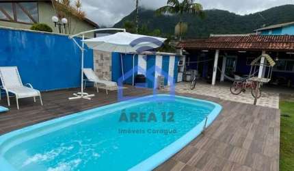 Casa com piscina à venda no condomínio Mar Verde, bairro da Tabatinga em Caraguatatuba, SP