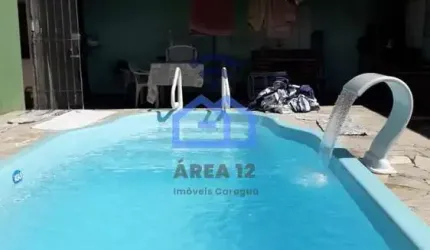 Casa com piscina à venda no bairro do Perequê Mirim em Caraguatatuba, SP
