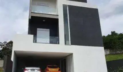 VENDA CASA CONDOMÍNIO ARUJÁ VILLE II EXCELENTE IMÓVEL COM A/T 432m² A/C 330m² distribuídos em 3 suítes sendo 1 suíte máster com closet, banheira de hi