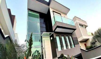 VENDA DE CASA CONDOMÍNIO REAL PARK ARUJÁ COM A/T 300m² e A/C 385m² São 4 dormitórios, sendo 3 suítes. CONSULTE-NOS.