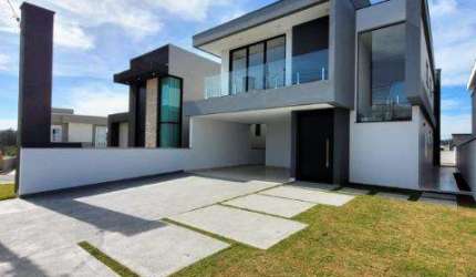 VENDA DE CASA NO CONDOMÍNIO REAL PARK, EM ARUJÁ/SP, 300m² com 4 suítes, 3 salas, área gourmet, piscina e garagem para 4 autos. CONSULTE-NOS.
