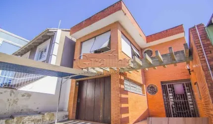Casa com 4 quartos à venda na Rua Eudoro Berlink, 482, Auxiliadora, Porto Alegre por R$ 1.500.000