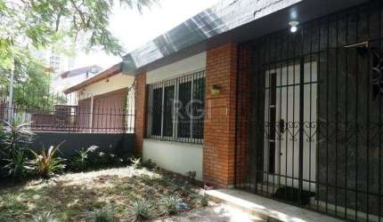 Casa no bairro Jardim Botânico de 3 dormitórios e 2 vagas