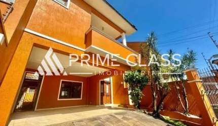 Casa com 3 quartos à venda na Rua Bélgica, 65, Moinhos De Vento, Canoas por R$ 1.169.900