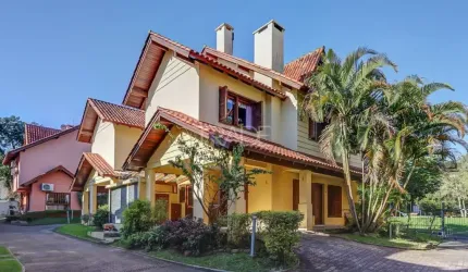 Casa em condomínio fechado com 3 quartos à venda na Rua Luís Felipe Monmany, 101, Guarujá, Porto Alegre por R$ 650.000