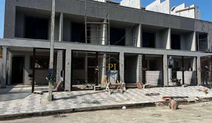 Casa com 3 dormitórios à venda, 108 m² por R$ 610.000 - Caiçara - Praia Grande/SP