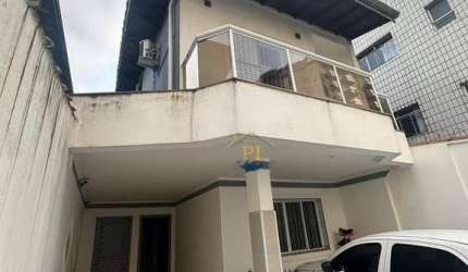 Casa com 3 dormitórios à venda, 129 m² por R$ 685.000 - Caiçara - Praia Grande/SP