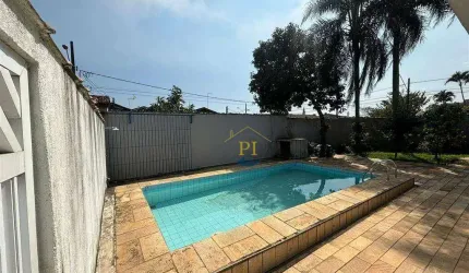 Casa com 3 dormitórios à venda, 100 m² por R$ 900.000 - Maracanã - Praia Grande/SP