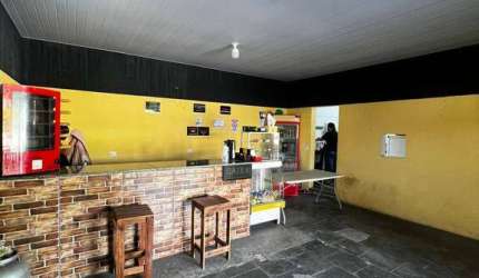 Salão comercial em Terra Preta com casa nos fundos à venda