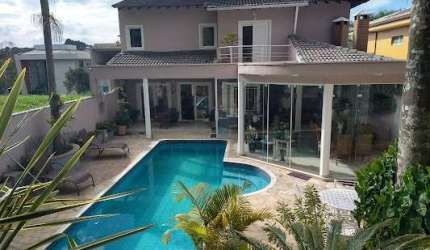 Casa de condomínio sobrado para venda tem 390 metros quadrados com 4 quartos