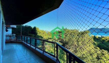 Apartamento à venda na Praia do Tombo I Rocha Imóveis Guarujá.